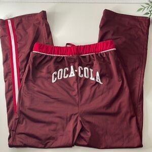 Coca-Cola silky soft sweatpants. Size Small. Drawstring waist. Pockets at waist.